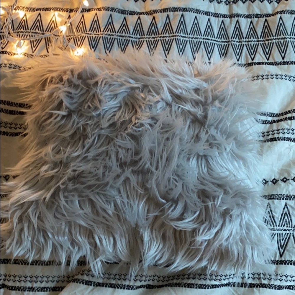 Fluffy light grey throw pillow